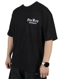 Black oversized DUALITY OVERSIZED TEE with white "One Rep ultimate" print on chest, made of 100% cotton, casual fit.