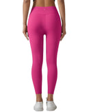 Back view of woman wearing pink Oru Soft Pocket Leggings with high-waisted fit and compressive waistband