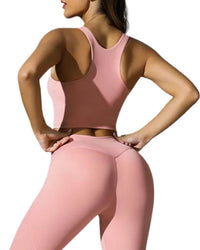 Back view of woman wearing pink ORU ULTRALUXE SPORTS BRA and matching leggings, seamless and breathable activewear