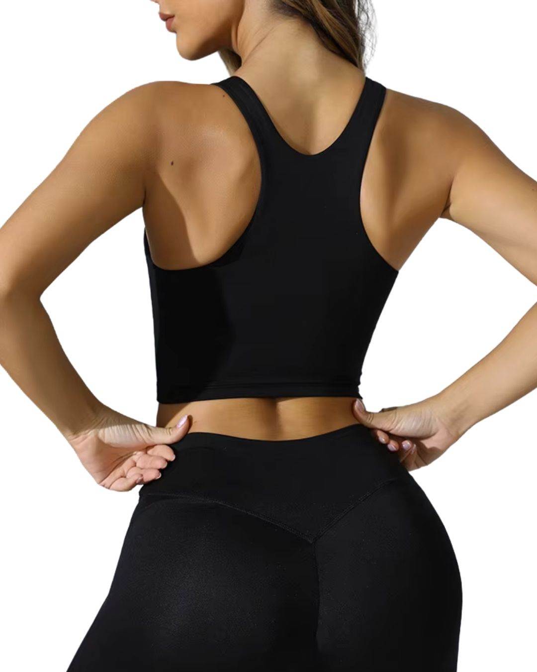 Back view of woman wearing black ORU ULTRALUXE SPORTS BRA with racerback design and seamless, stretchy fabric
